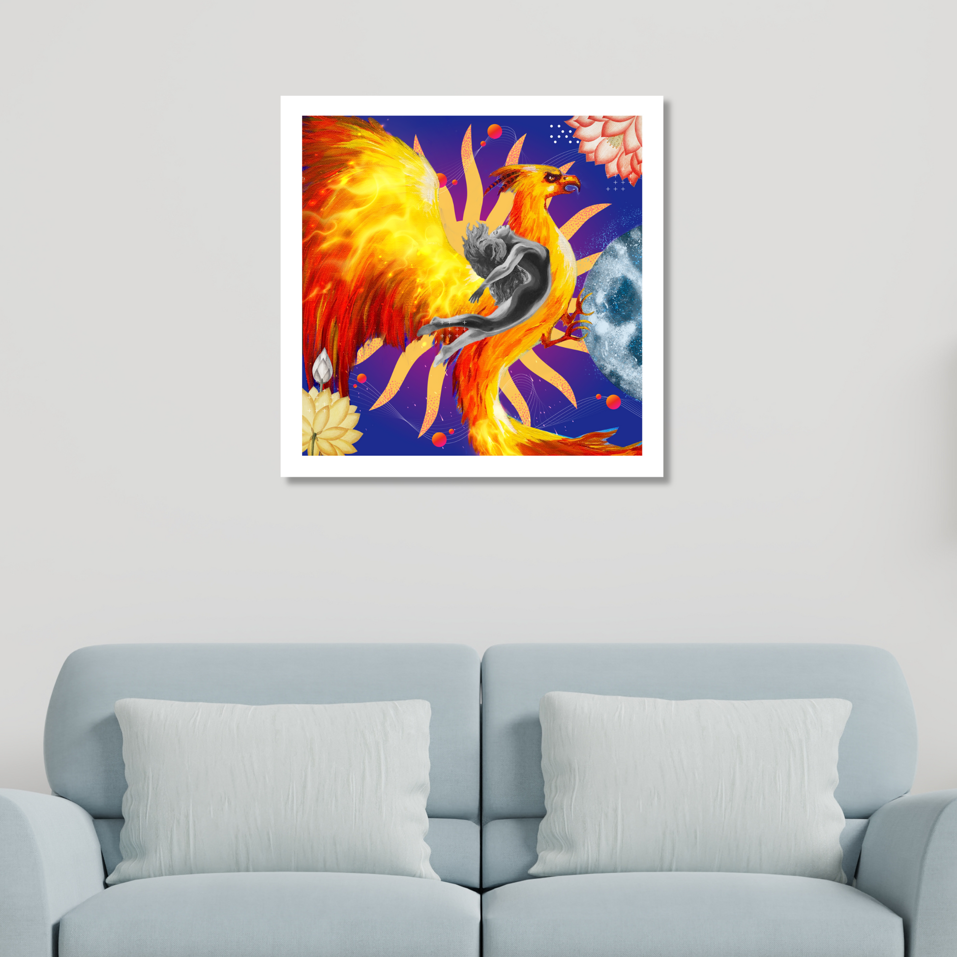 The Rebirth Rising Phoenix Art Print displayed on a home wall. This original wall decor showcases a woman, golden phoenix, blooming flowers, and a moon, enhancing any room's style.